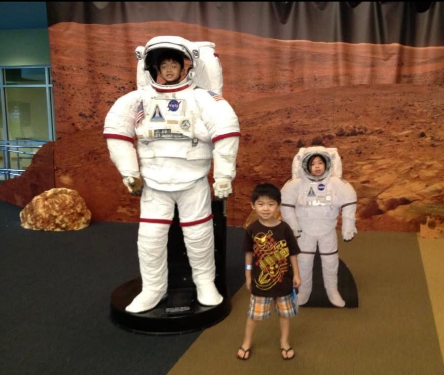Jonathan at a space center exhibit as a child